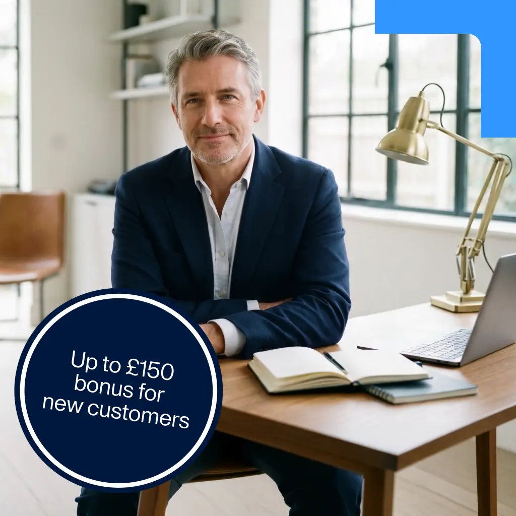 A man in a suit sits at a desk with a laptop and notebook. A dark blue circular badge in the foreground says "Up to £150 bonus for new customers"